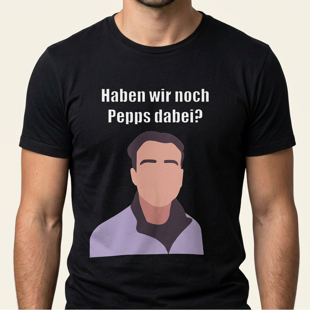 Mann trägt schwarzes Meme T-Shirt mit Frontprint „Haben wir noch Pepps dabei?" und Gesichts-Illustration